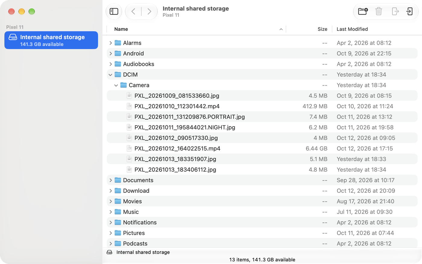 The app window showing a connected Pixel 11. The Camera folder is open, listing photos and videos with their sizes and dates.